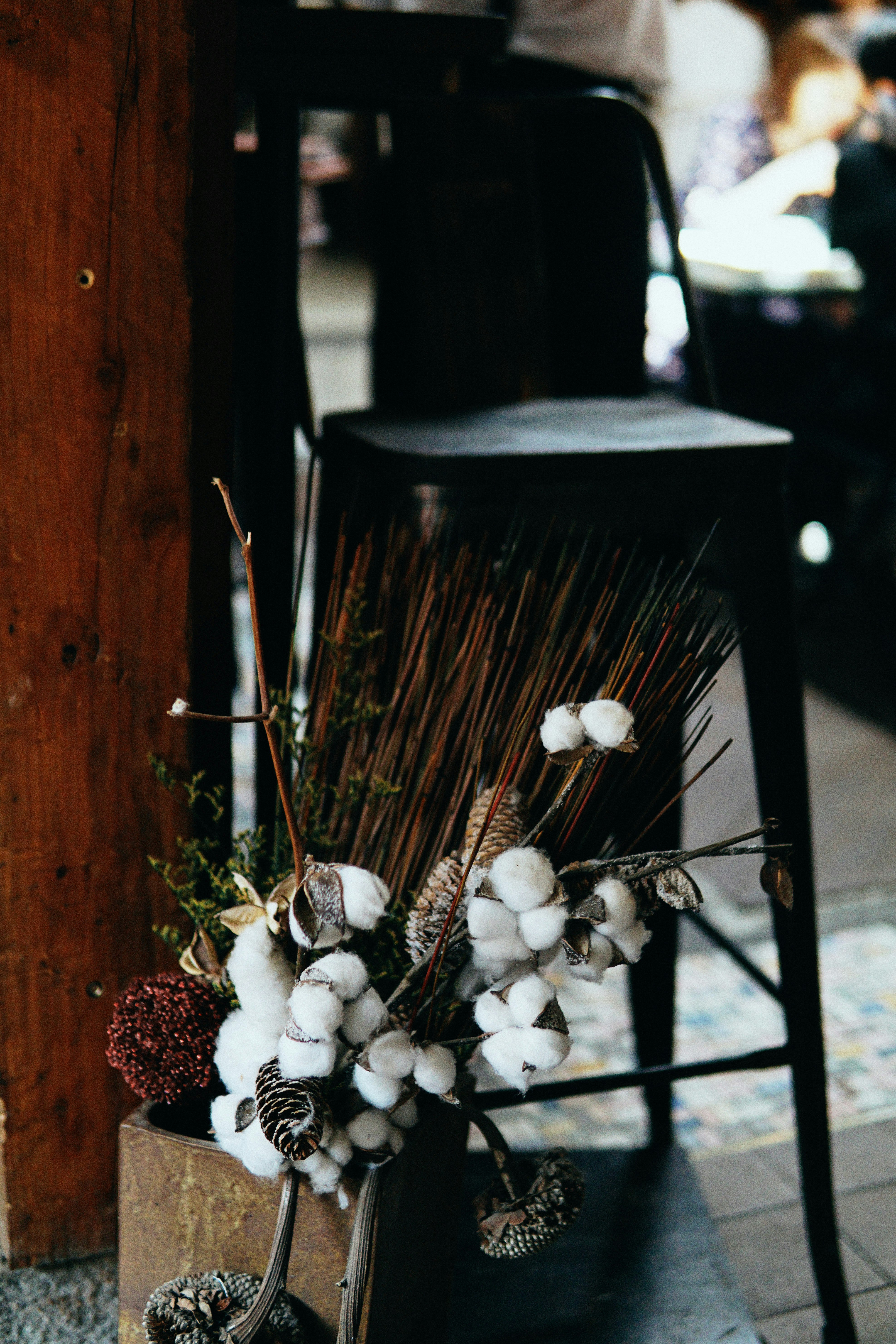 white flowers on black metal fence